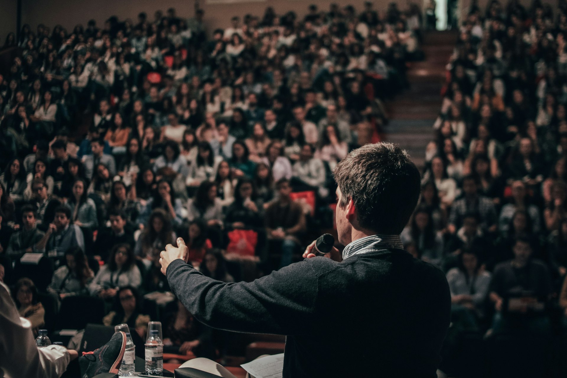 A preacher speaking to a large crowd
